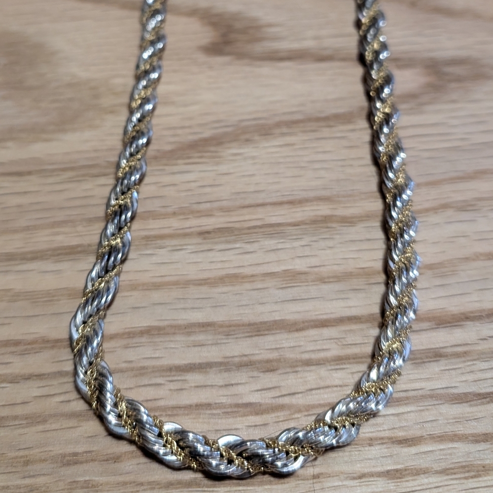 Thick Silver Necklace, w/ smaller gold chain intertwined.